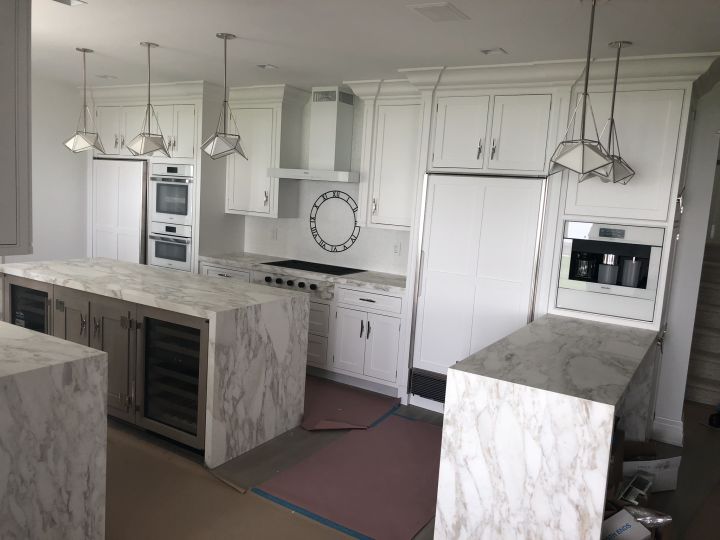 millwork_install_gurskyi_White Kitchen Marble Waterfall Islands – Kitchens & Cabinetry