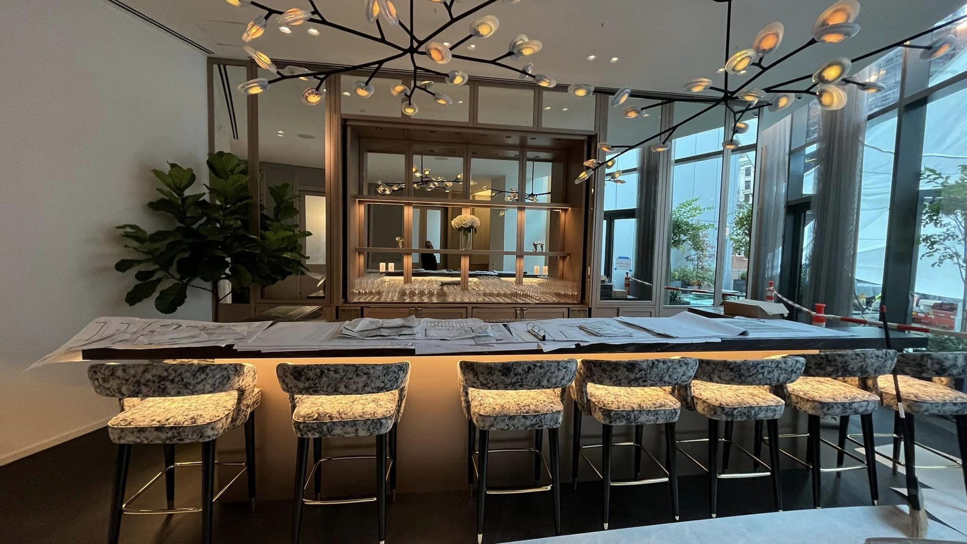 millwork_install_gurskyi_Hospitality bar with custom millwork back bar and steel-framed glass partition